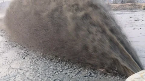 Dredging sediment mud from river by heavy water pump video. Stock Footage 297765866