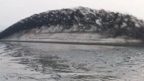 Dredging sediment mud from river by heavy water pump video. Stock Footage 297765867