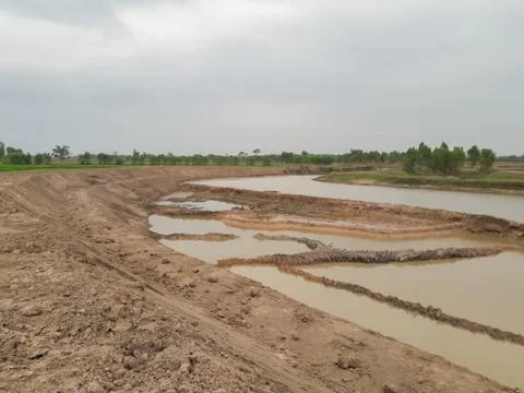 Dredging of shallow rivers for use in agriculture in Thailand. Stock Photos