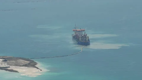 Dredging ship creating new island in Dubai Stock Footage 96072287