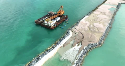 Dredging Vessel Pumping Sand In Commercial Port Construction Site Aerial Dr.. Stock Footage 340327356