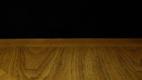 Dreidel Spins on Wood Table Stock Footage