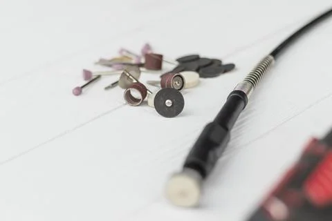 Dremel. precise and accurate processing of the product. on a wooden backgroun Stock Photos