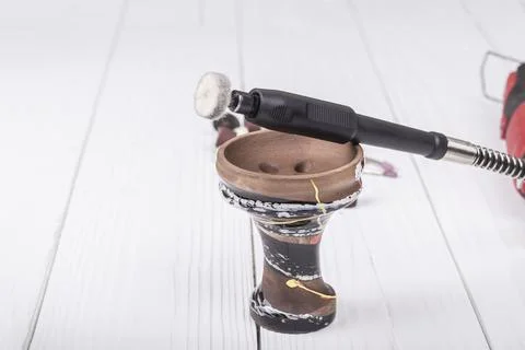 Dremel. precise and accurate processing of the product. on a wooden backgroun Stock Photos