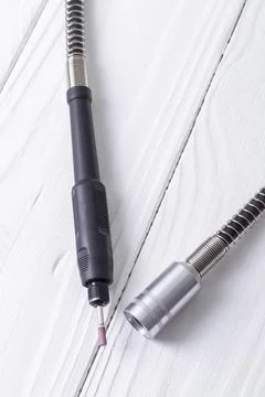 Dremel. precise and accurate processing of the product. on a wooden backgroun Stock Photos