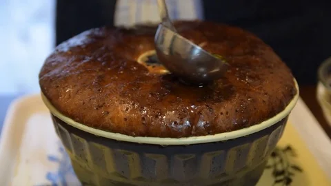 Drenching babà with rum Stock Footage 74397186