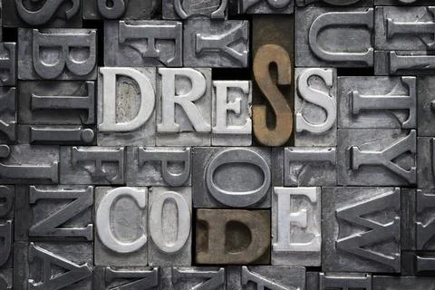 Dress code met dress code phrase made from metallic letterpress type with ... Foto stock