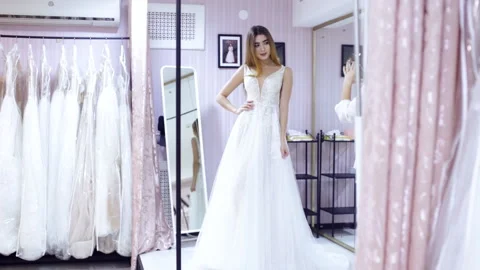 Dress fitting in a bridal store Video stock 102733399