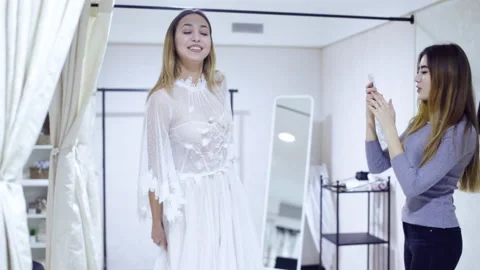 Dress fitting in a bridal store Stock Footage 102857521