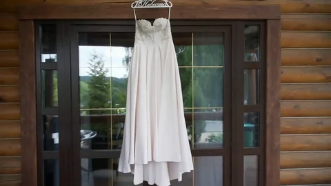 Dress hanging in the window Stock Footage 80011487