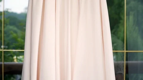 Dress hanging in the window 스톡 동영상 80012200