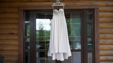 Dress hanging in the window Видео 80058299