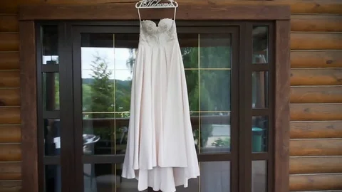 Dress hanging in the window Stock-Footage 80059229