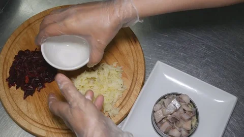 Dressed herring. Preparation of Russian salad, herring under a fur coat. Stock Footage 83528032