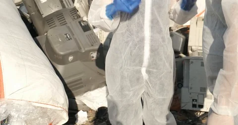 Dressed in protective suit, blue gloves, gas masks with filter, breathing hazard Stock Footage 119050358
