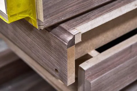 Dresser elements in a workshop. Solid wood chest of drawers. Furniture manufa Stock Photos