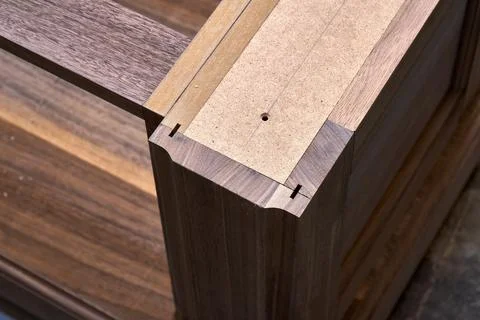 Dresser elements in a workshop. Solid wood chest of drawers. Furniture manufa Stock Photos