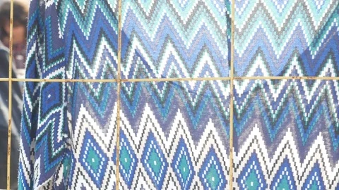 Dresses and other clothes on the flea market Stock Footage 79448998