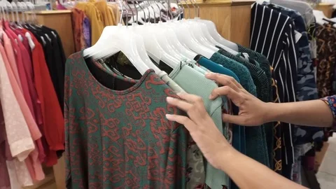 Dresses on hangers Stock Footage 101935972