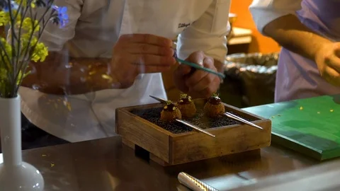 Dressing appetizers in a Michelin star restaurant Stock Footage 106627166