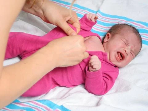 Dressing baby Stock Photos