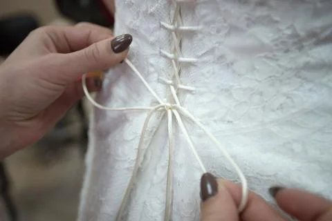 Dressing bride before wedding Stock Photos