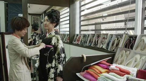 Dressing up in a Ceremonial Kimono Stock Footage 66540501