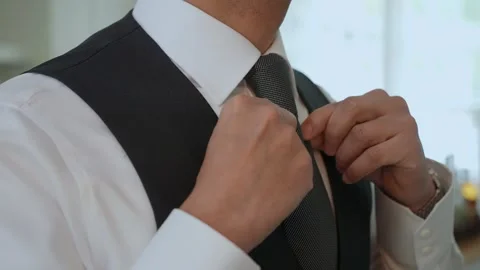 Dressing Up An Elegant Guide to Tying a Necktie in a Stylish and Sophisticated Video stock 314576177