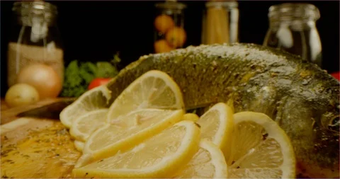 Dressing fish with lemon juice macro shot Stockbeeldmateriaal 126287661