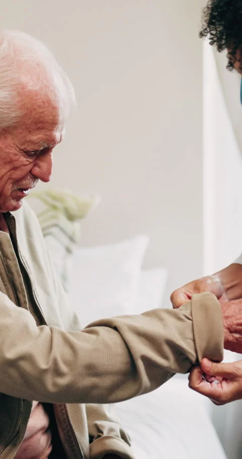 Dressing, help and nurse with old man in retirement home for assisted living or Stock Footage 339047354