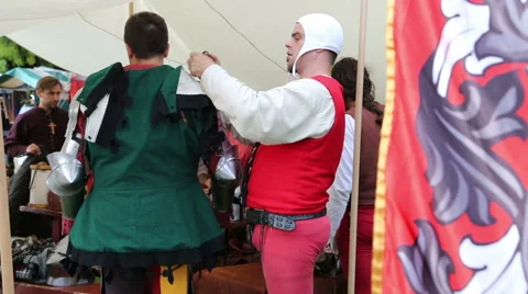 Dressing a knight before battle Stock Footage 54661840