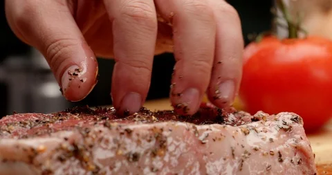 Dressing New York steak with olive oil and spices Stock-Footage 126257839
