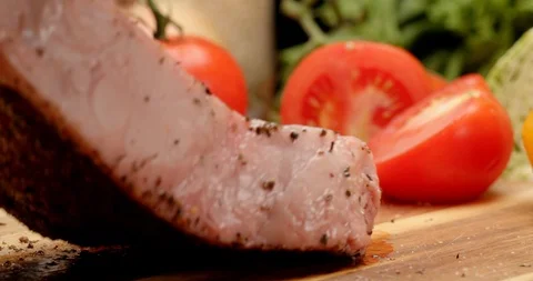 Dressing New York steak with olive oil and spices Stock Footage 126257848