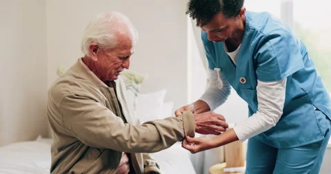 Dressing, nurse or old man in bedroom with support, grooming or elderly care in Stock Footage 338426480
