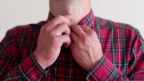 Dressing a shirt Stock Footage 100628286