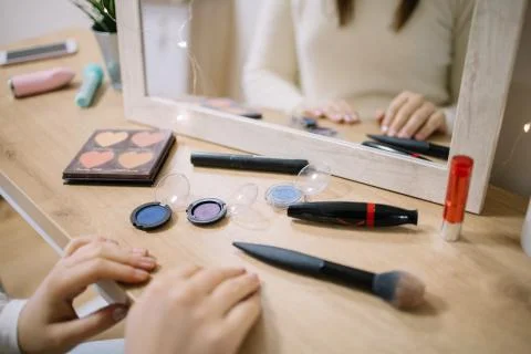 Dressing table with makeup, mirror and lights Stock Photos