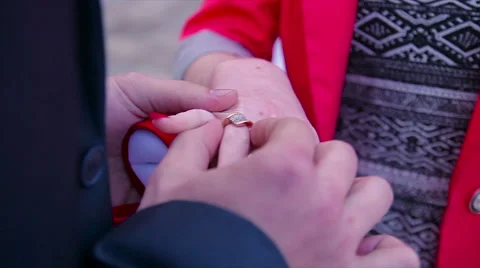 Dressing wedding ring Stock Footage 65744000