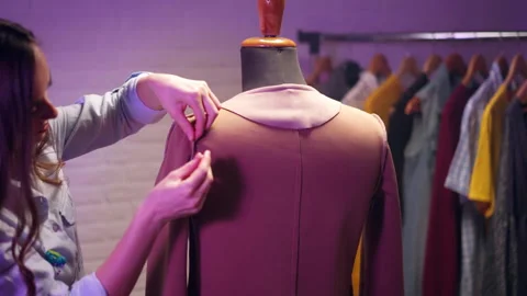 Dressmaker creating individual jacket pinning tailored fabric parts on mannequin 스톡 동영상 301456939