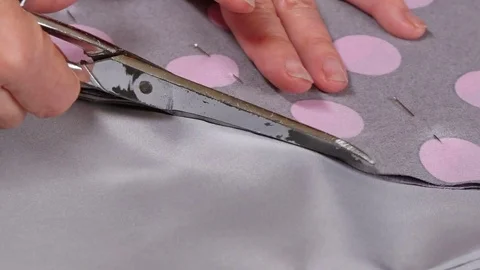 Dressmaker Cutting Clothes with Scissors Closeup Stock Footage 80558159