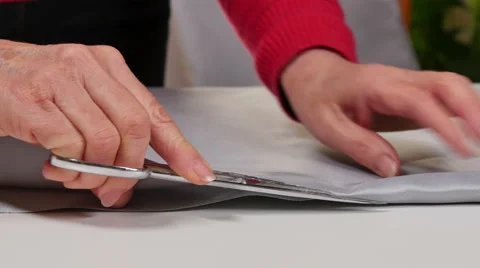 Dressmaker Cutting Clothes with Scissors Stock Footage 59738810
