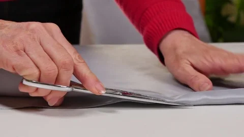 Dressmaker Cutting Clothes with Scissors Video stock 80558114