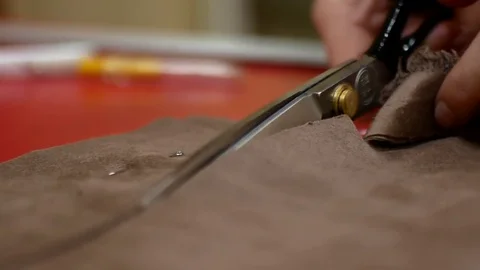 Dressmaker cutting fabric Video stock 83569646