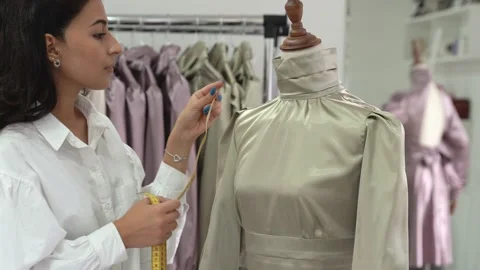Dressmaker taking measurements Stock Footage 165759731
