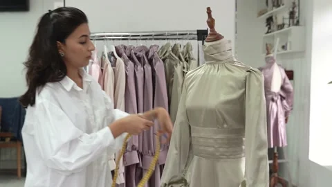 Dressmaker taking measurements Stock Footage 165883024