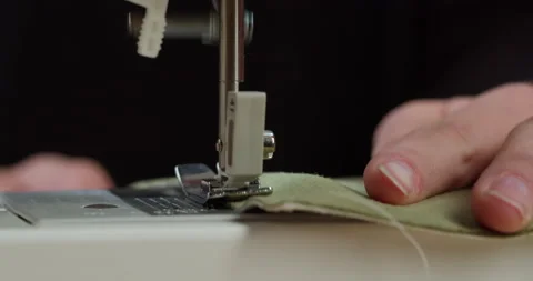 Dressmaker working on sewing machine close-up. Tailoring and professional Stock Footage 167901112