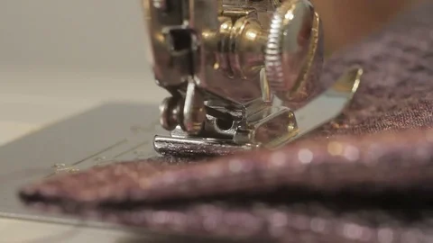 Dressmaker working on a sewing machine in her studio at table. Stock Footage 82153736