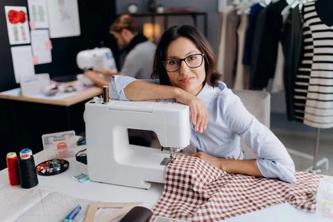 Dressmaker working on sewing machine 스톡 사진