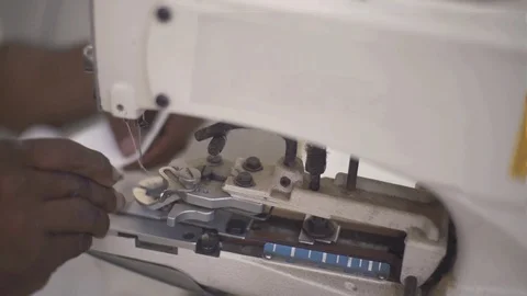 Dresssmaker Sews The Button With Sewing Machine, Closeup Of Hands. Stock Footage 113078406