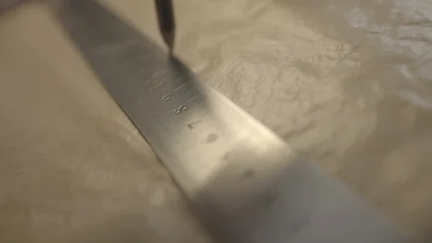 Drew a flat line along the ruler on paper Stock Footage 102334076