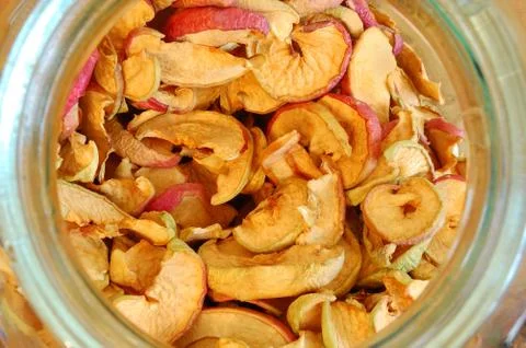 Dried apples in a glass jar. top view down through a jar mouth Stock Photos
